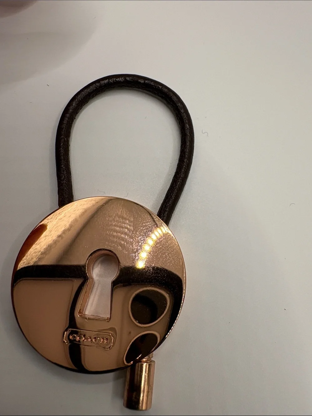 Coach Rose Gold Tone and Brown Leather Strap Charm keychain